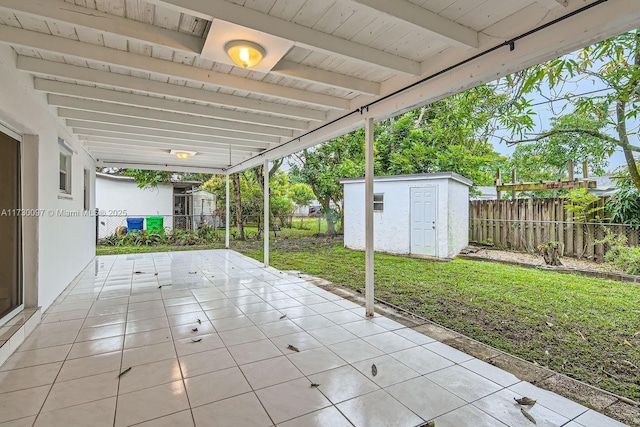 view of patio with a storage shed