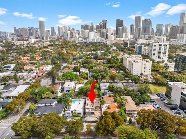 birds eye view of property with a view of city