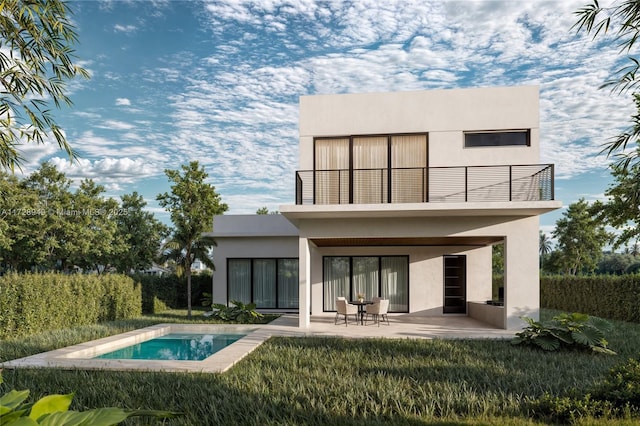 back of house featuring stucco siding, a patio, and a balcony