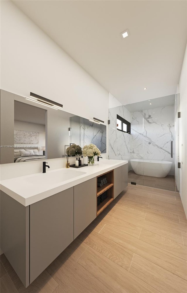 kitchen with light wood-style flooring, gray cabinets, modern cabinets, and open floor plan