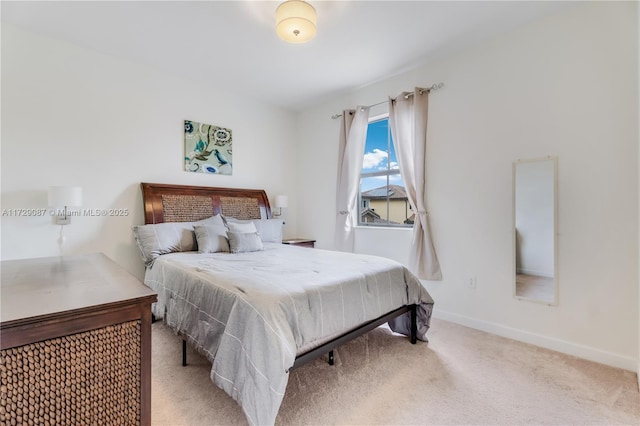 bedroom with light colored carpet