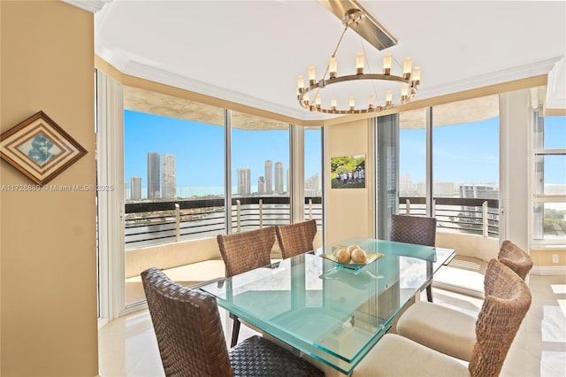 dining room with an inviting chandelier, light tile patterned floors, and crown molding