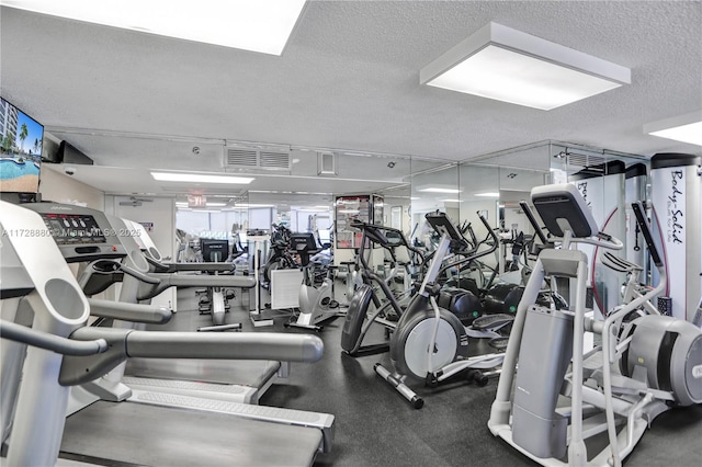 workout area featuring a textured ceiling