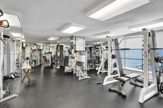 gym with a textured ceiling