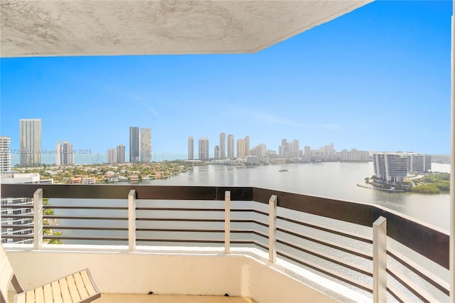 balcony with central AC and a water view