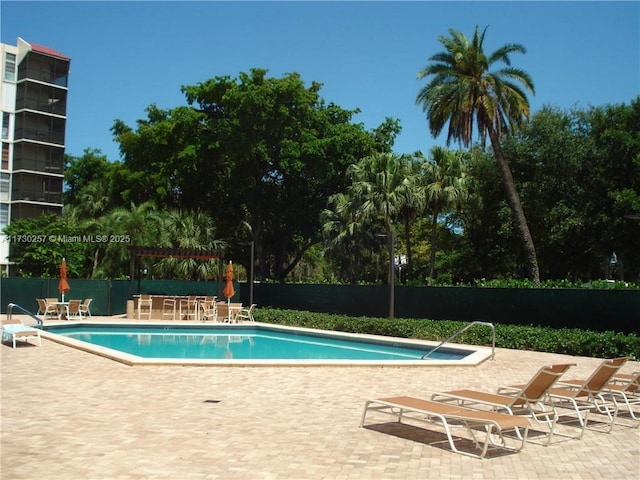 view of swimming pool featuring a patio area