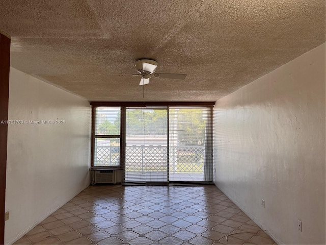 unfurnished room with ceiling fan