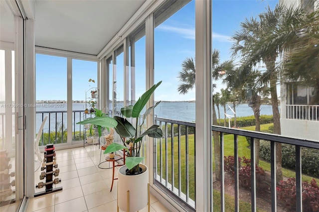 sunroom / solarium with a water view