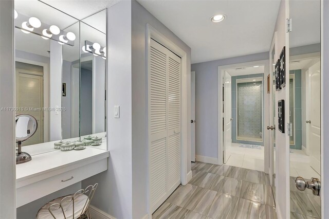 kitchen with sink, pendant lighting, light tile patterned floors, and french doors