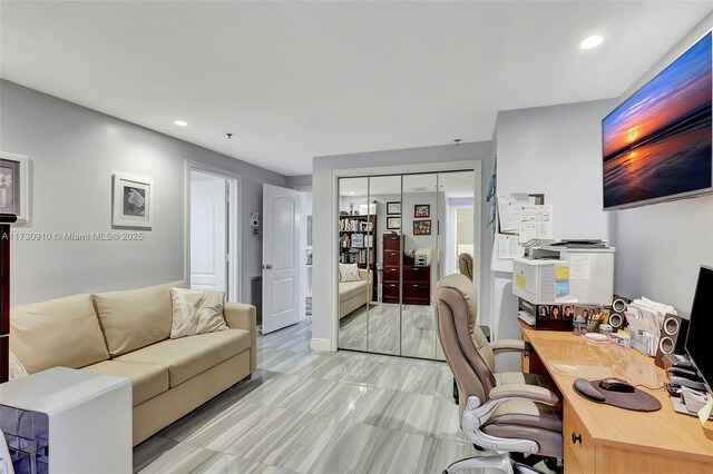 living room featuring ceiling fan, ornamental molding, and a healthy amount of sunlight