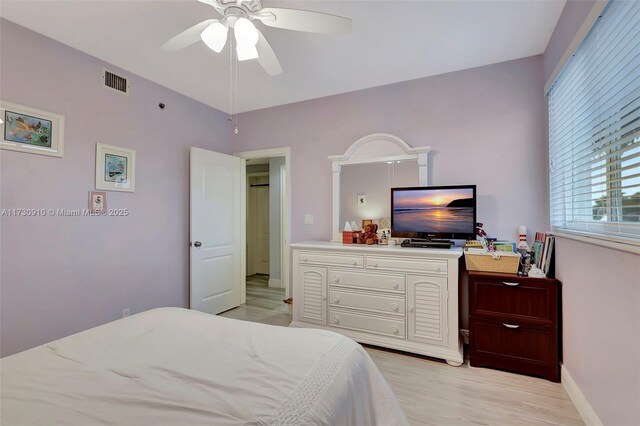 bedroom featuring ceiling fan and access to exterior