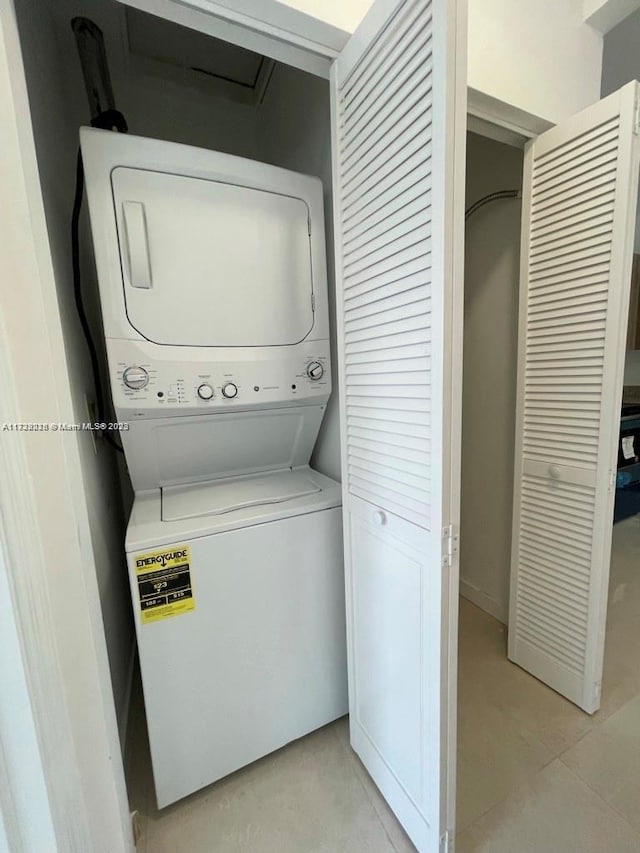 washroom with stacked washer and clothes dryer