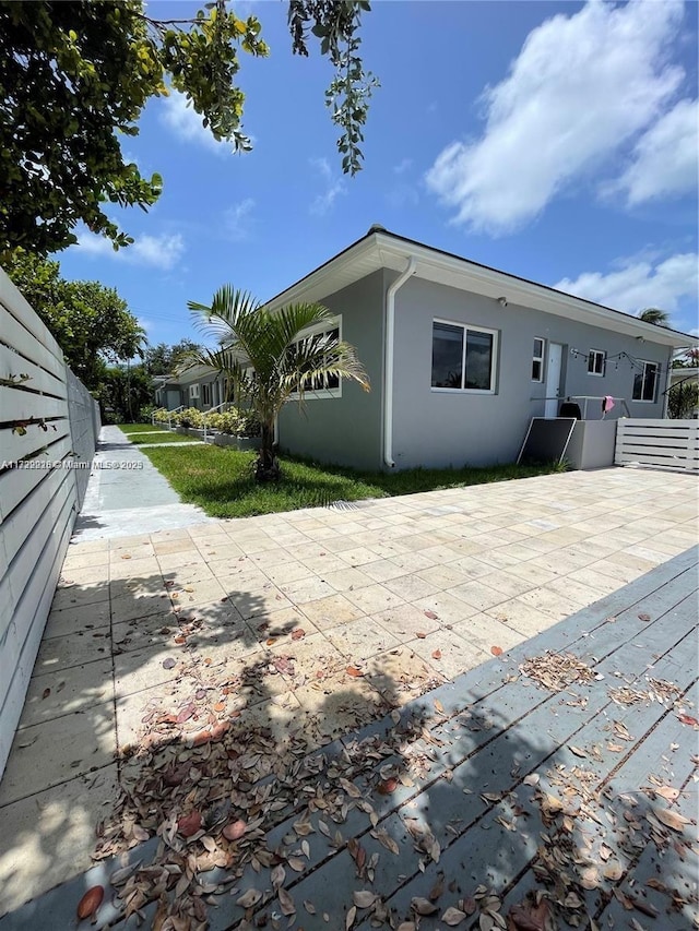 back of house with a patio