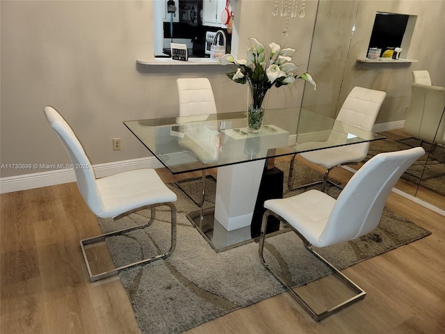 dining room with light hardwood / wood-style flooring