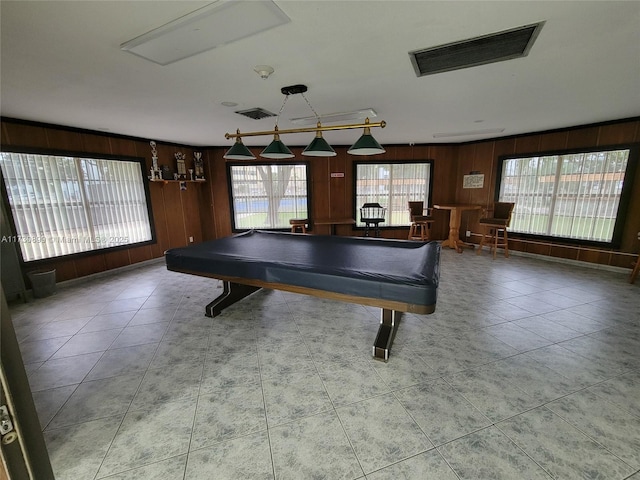 game room with billiards, wood walls, and light tile patterned floors