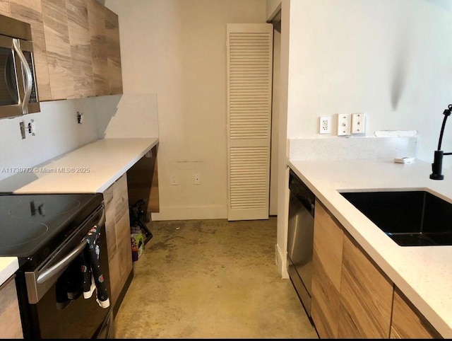 kitchen featuring sink and black appliances