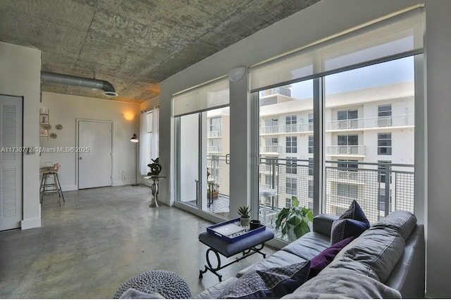 living room featuring concrete flooring