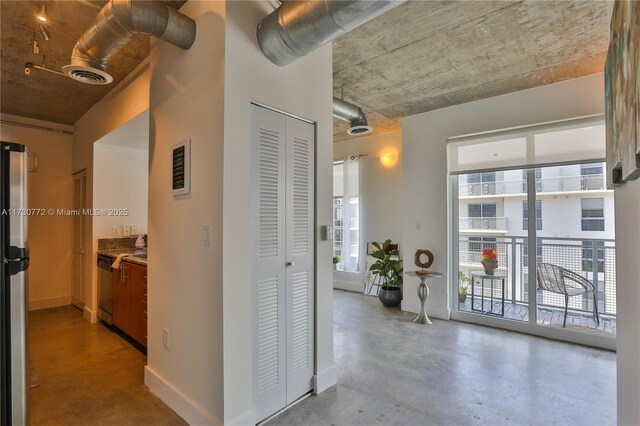 living area with concrete floors