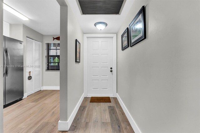 bedroom featuring hardwood / wood-style floors, a closet, and ceiling fan