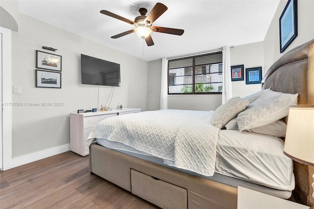 bedroom featuring ceiling fan and wood-type flooring