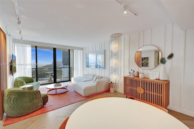 living room featuring expansive windows and track lighting