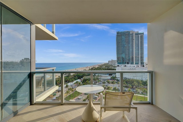 balcony featuring a water view