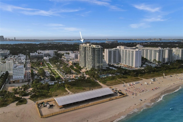 bird's eye view with a water view and a view of the beach