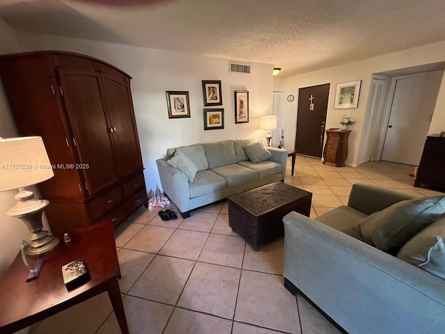 9040 SW 125th Ave Unit D210, Miami, FL 33186 - living area with light tile patterned floors and a textured ceiling
