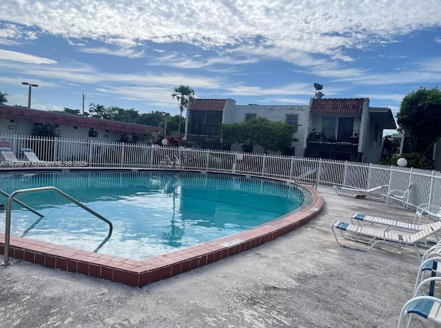 view of swimming pool featuring a patio