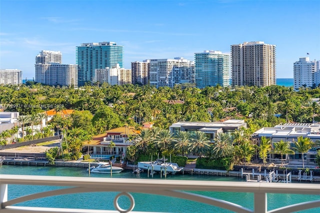 view of swimming pool with a city view and a water view