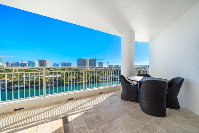 balcony featuring a water view