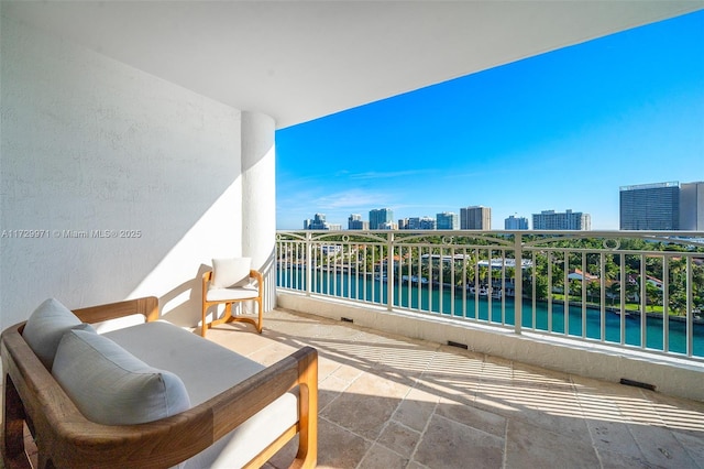 balcony with a city view and a water view