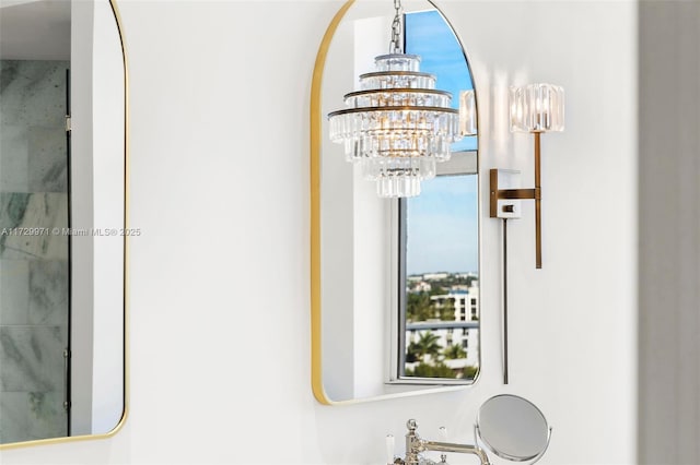 details featuring a chandelier and walk in shower