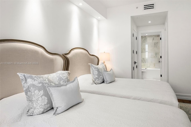 bedroom with recessed lighting, visible vents, and ensuite bathroom