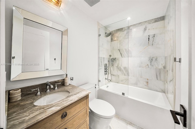 bathroom featuring bathtub / shower combination, vanity, and toilet