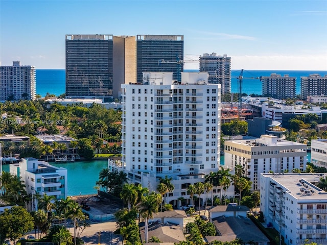 birds eye view of property with a view of city and a water view