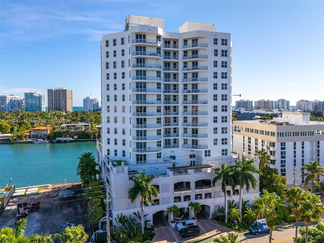 view of property featuring a city view and a water view