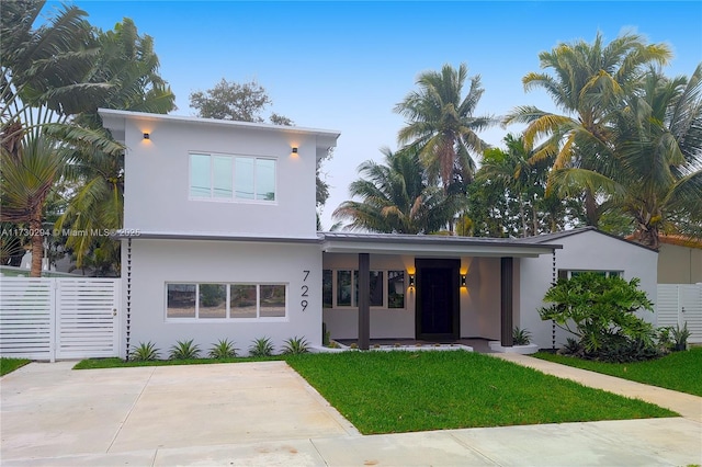 contemporary home with a front yard