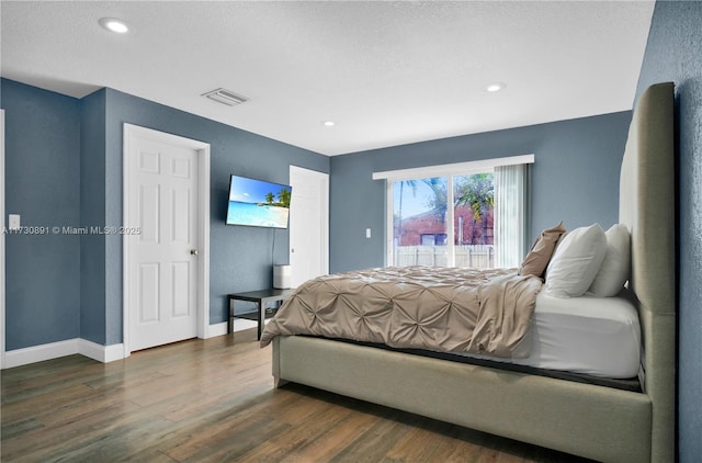 bedroom featuring dark wood-type flooring