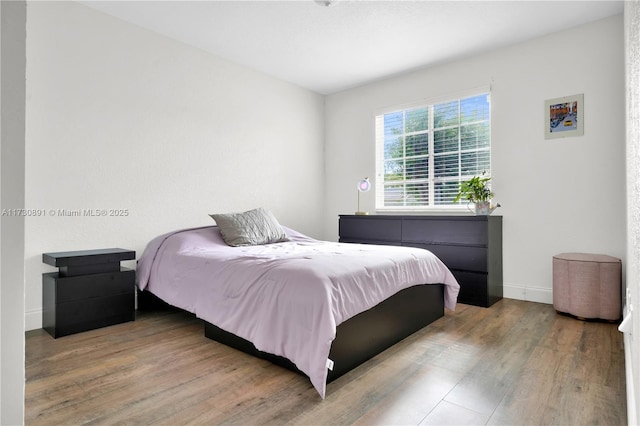 bedroom featuring hardwood / wood-style flooring