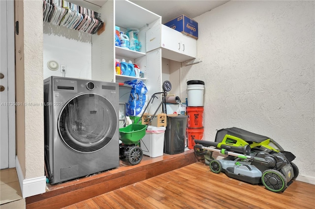 laundry area featuring washer / clothes dryer and hardwood / wood-style flooring