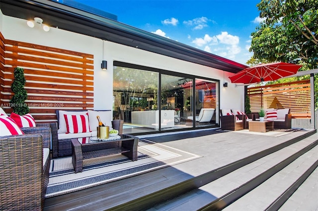 wooden terrace featuring an outdoor hangout area