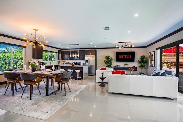dining space with recessed lighting, visible vents, ornamental molding, a chandelier, and light tile patterned flooring