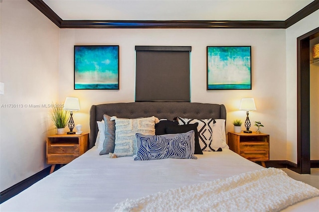 bedroom with baseboards and crown molding