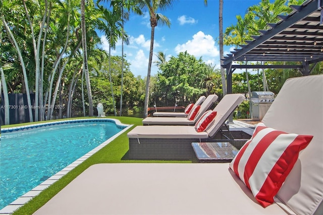 pool with a patio, fence, and a pergola