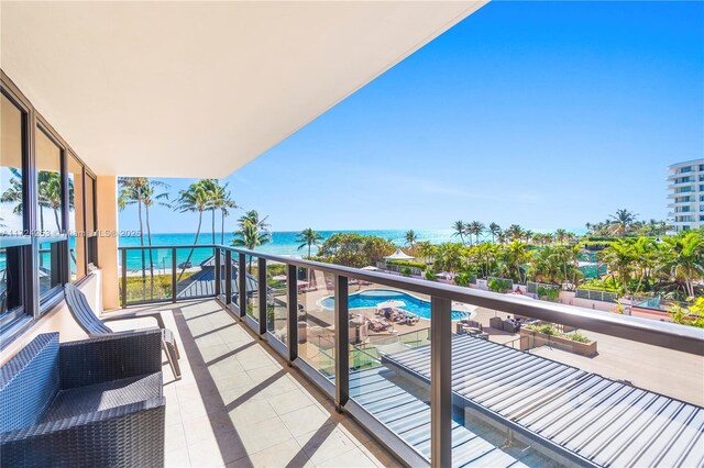 balcony featuring a water view