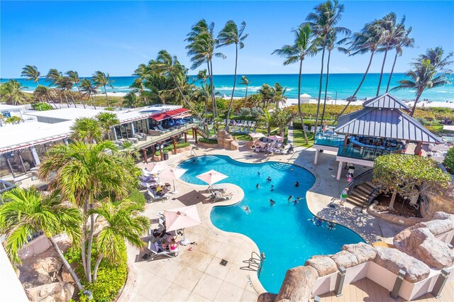 view of pool with a water view