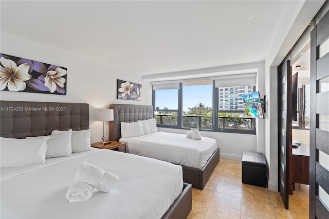 bedroom with light tile patterned flooring