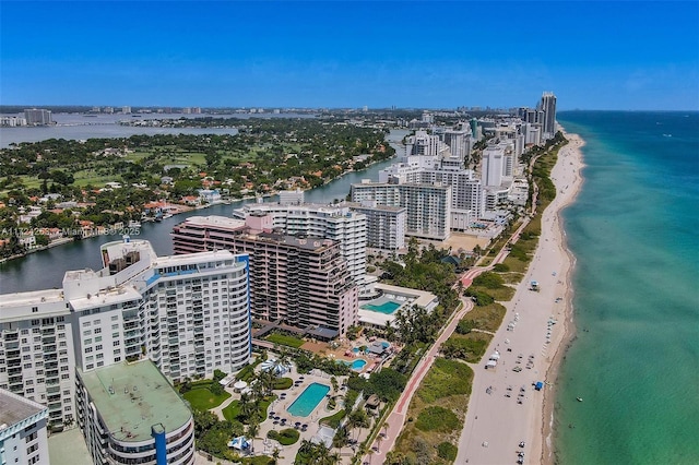 bird's eye view with a beach view and a water view