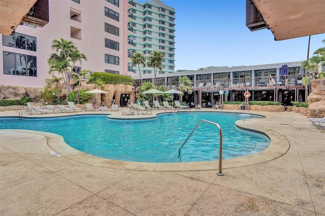 view of swimming pool with a patio